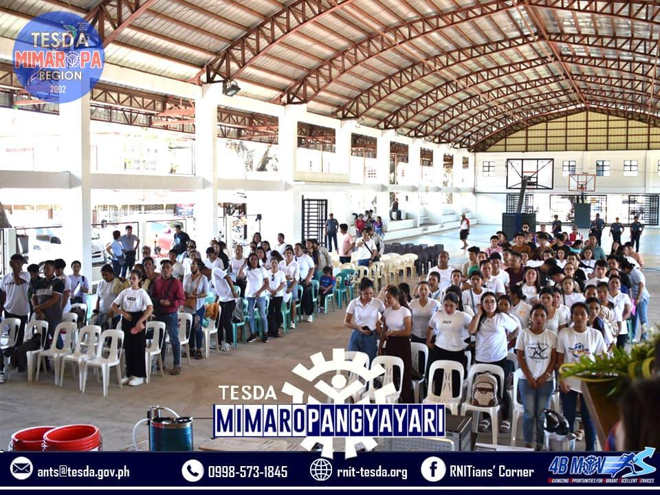 TESDA graduates receiving or holding their starter toolkits